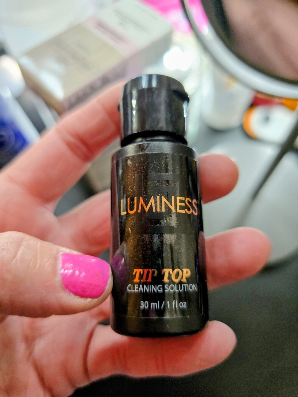 Luminess Tip Top Cleaning Solution - Black Bottle with Orange Logo